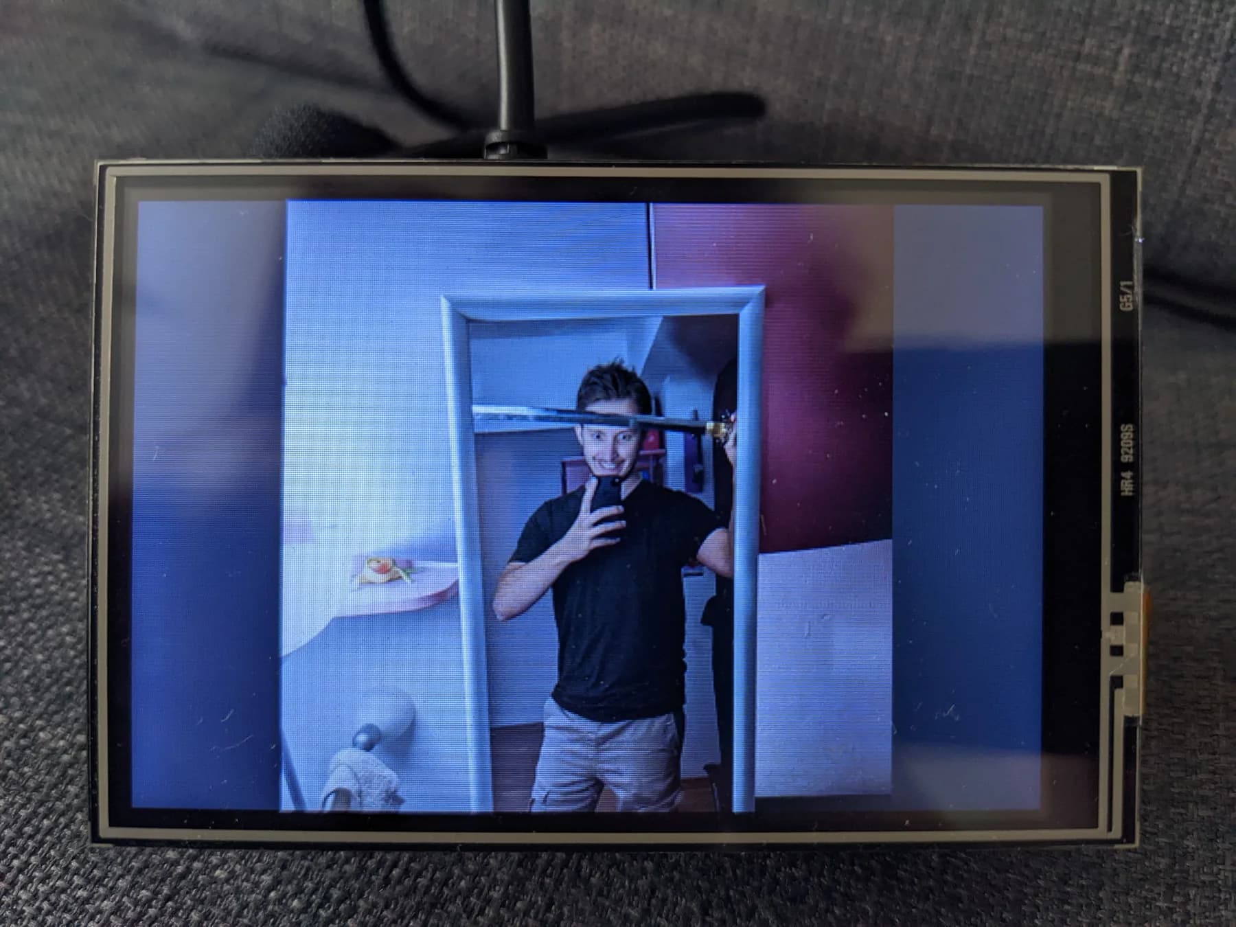 LCD prototype displaying a mirror selfie