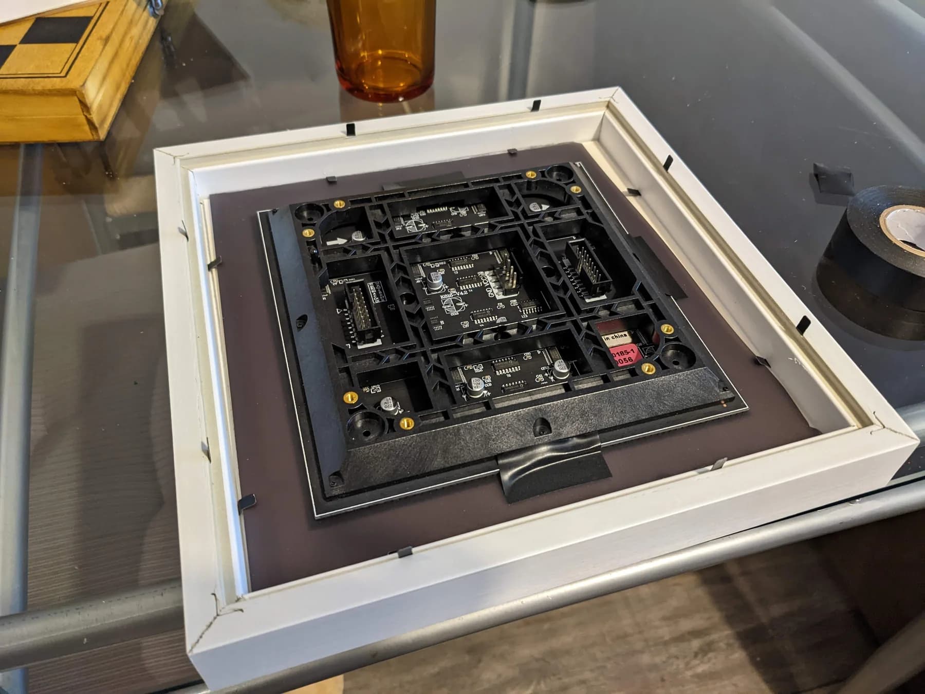 Back of a white picture frame fitted with the LED matrix panel